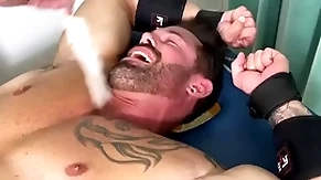 Muscular hunk endures bondage and torment in the sky half naked body