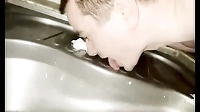 Happy-go-lucky boy licking elevate d vomit beach toilet